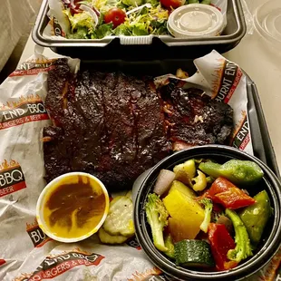 Juicy ribs, mixed veggies-bell peppers, onions, zucchini and broccoli, crisp salad with citrus vinaigrette .