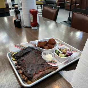 a plate of ribs and sides