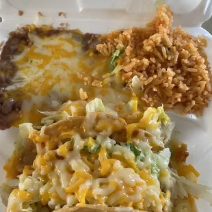 a close up of a taco and rice dish