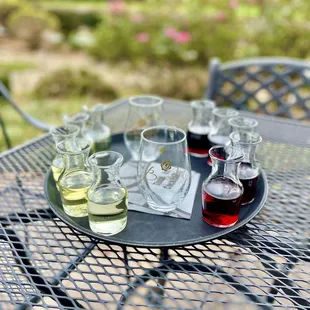 four glasses of wine on a tray