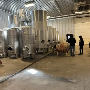 a group of people in a winery
