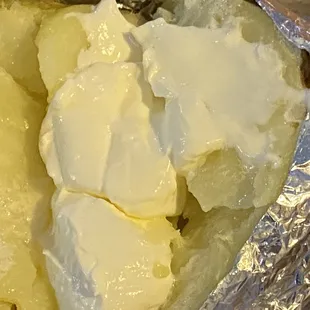 Baked potato with butter and sour cream