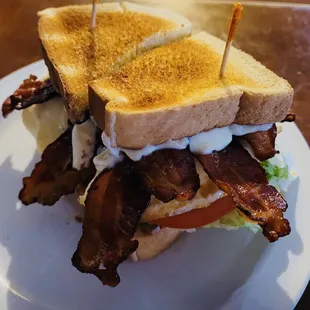 a sandwich with bacon and lettuce