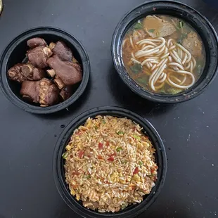 three bowls of food on a table