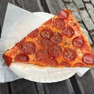 a slice of pepperoni pizza