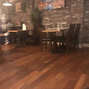 people sitting at tables in a restaurant