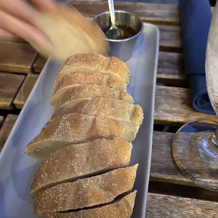 a loaf of bread on a plate with a spoon