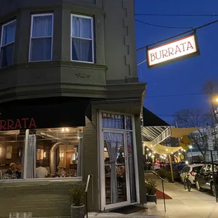 the outside of a restaurant at night