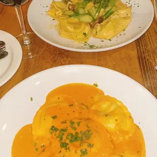 Lobster &amp; Crab ravioli and chef&apos;s special - homemade tortellini filled with veal with asparagus and porcini mushrooms in a creme sauce