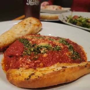 a plate of food and a glass of beer