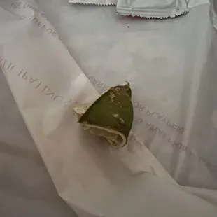 Disgusting used rotting dried up lime I just found when I opened our takeout bag.