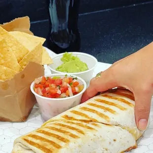 Burrito toasted if you like with chips, salsa, guacamole and a Mexican Coke.