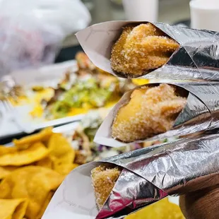 a person holding a plate of food