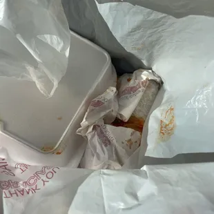 Enchilada Sauce just leaking all over the. And of course there's no napkins in the damn bag.