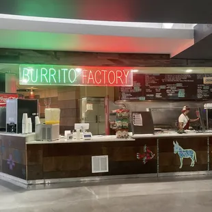a neon sign for burrito factory