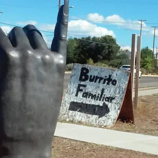 a hand holding a mailbox