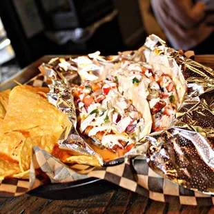 a plate of nachos and chips