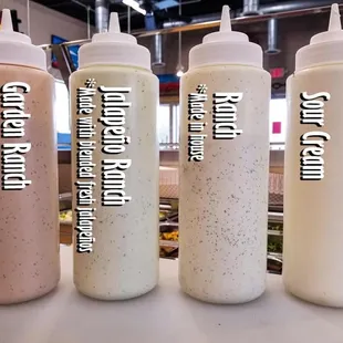 a row of condiments on a counter