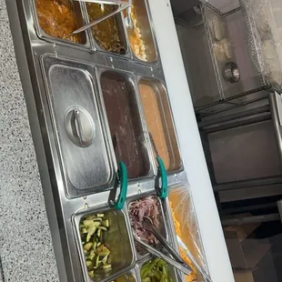 a man preparing food in a buffet