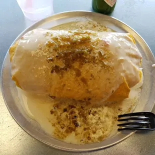 Large Smothered (queso and green sauce) Burrito with half brisket and half chicken. Even had guacamole inside. $8.61 after tax. Yum! 3/22/17