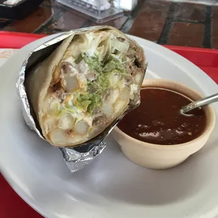 Try the California Burrito: Carne Asada (steak), French fries, cilantro, onions, sour cream, guacamole, cheese