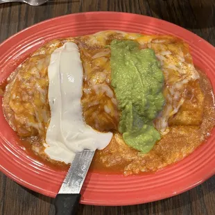 98. The King Burrito Chorizo, Egg, Cheese, Beans, rice Potatoes  Red Sauce w/ Sour Cream and Guacamole