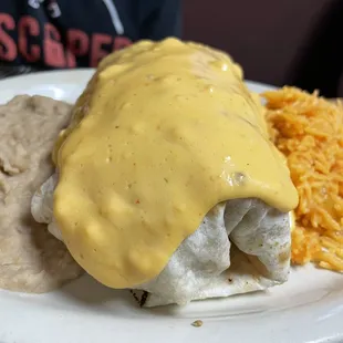 a plate of food with beans and cheese