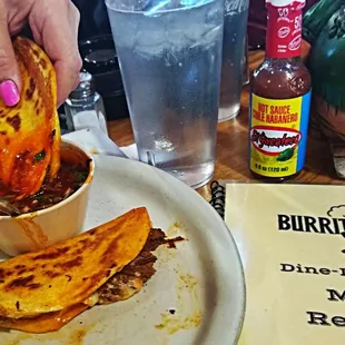 Queso Birria Juicy perfection  dipped in Consume