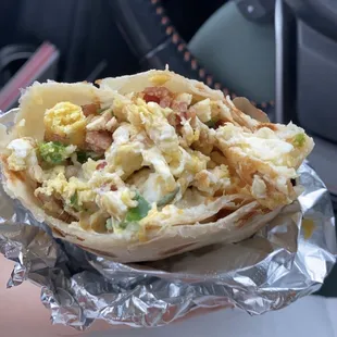 Bacon egg cheese burrito + sour cream &amp; jalapeños