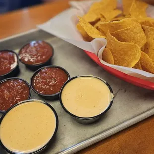 a tray of chips and condiments