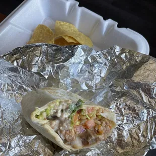 Steak burrito, queso,rice, refried beans, pico, hot salsa, cilantro and guac.