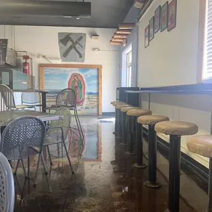 Updated decor and seating inside. Stool and &quot;bar&quot; seating along two walls.