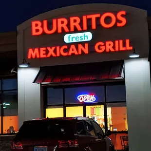 a car parked in front of the restaurant