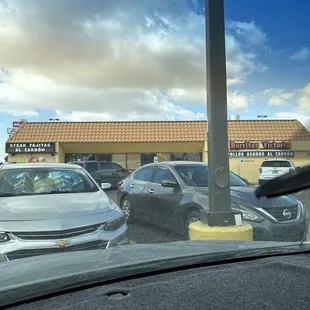 a view of a parking lot from inside a car