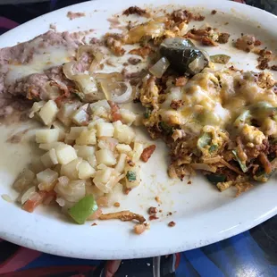 Breakfast Migas, potatoes and beans. Excellent!