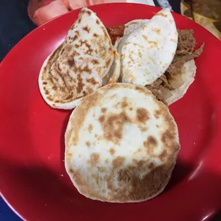 a person holding a plate of food