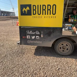 a man standing in front of a food truck