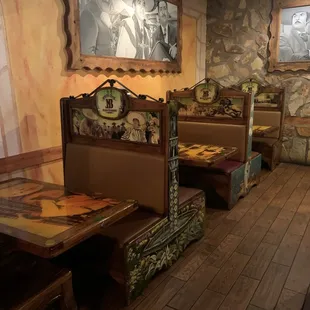 a dining area with a stone wall