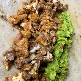 a burrito with meat and vegetables