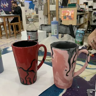 Left is the finished mug of my friend's, right is the second mug she just painted ready to be cured