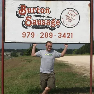 My friend poses in front of the sign!