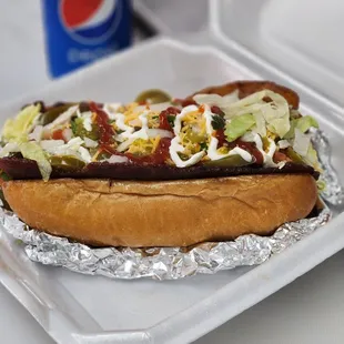 a hot dog with toppings