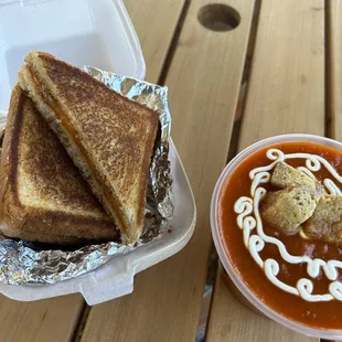 Grilled Cheese &amp; Tomato Soup with sour cream on top of soup