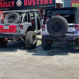 two jeeps parked next to each other