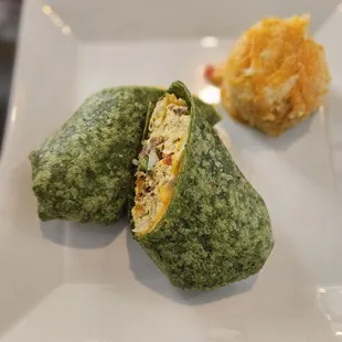 Breakfast burrito with sausage and the side of hashbrown casserole.