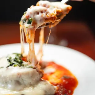 a plate of food with meat and cheese