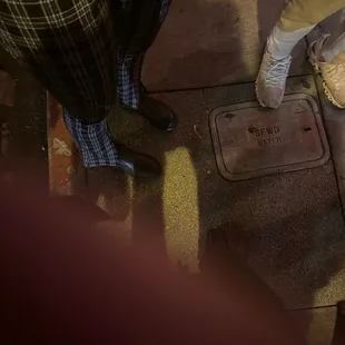 a man standing on the sidewalk