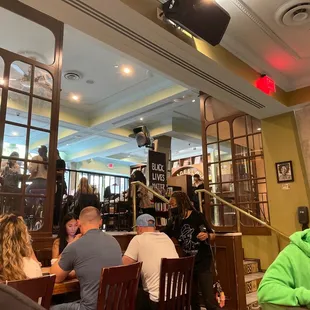 a group of people sitting in a restaurant