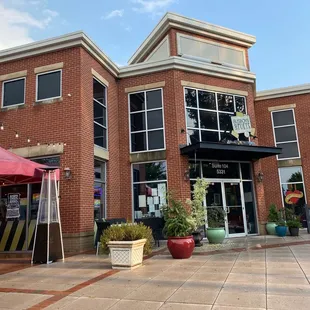 a red brick building with a sign that reads green summit cafe