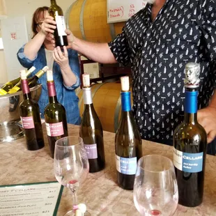 a man holding a bottle of wine